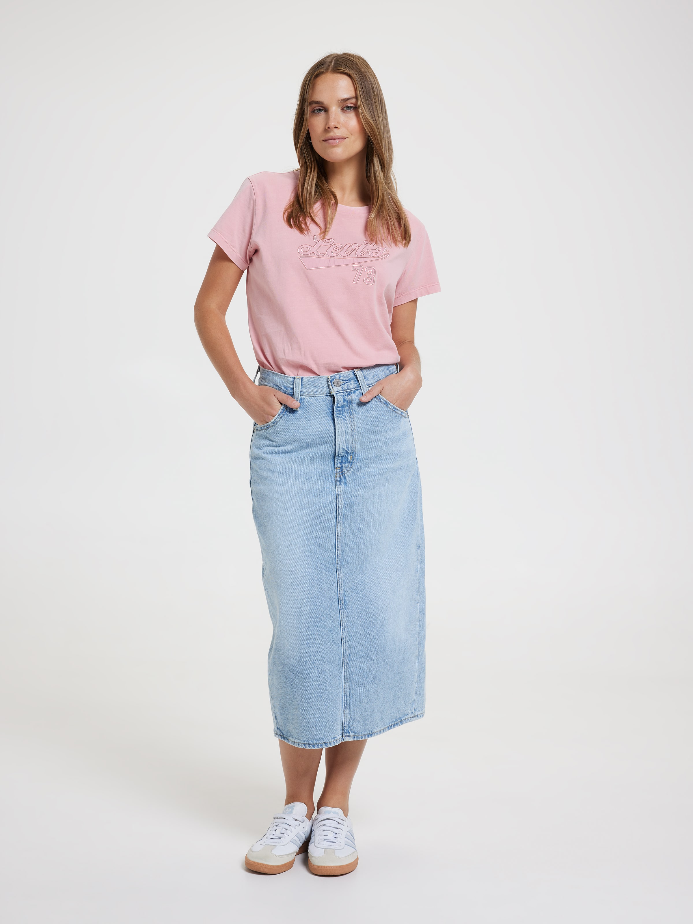 High Rise Back Slit Skirt In Riveting Clean Hem