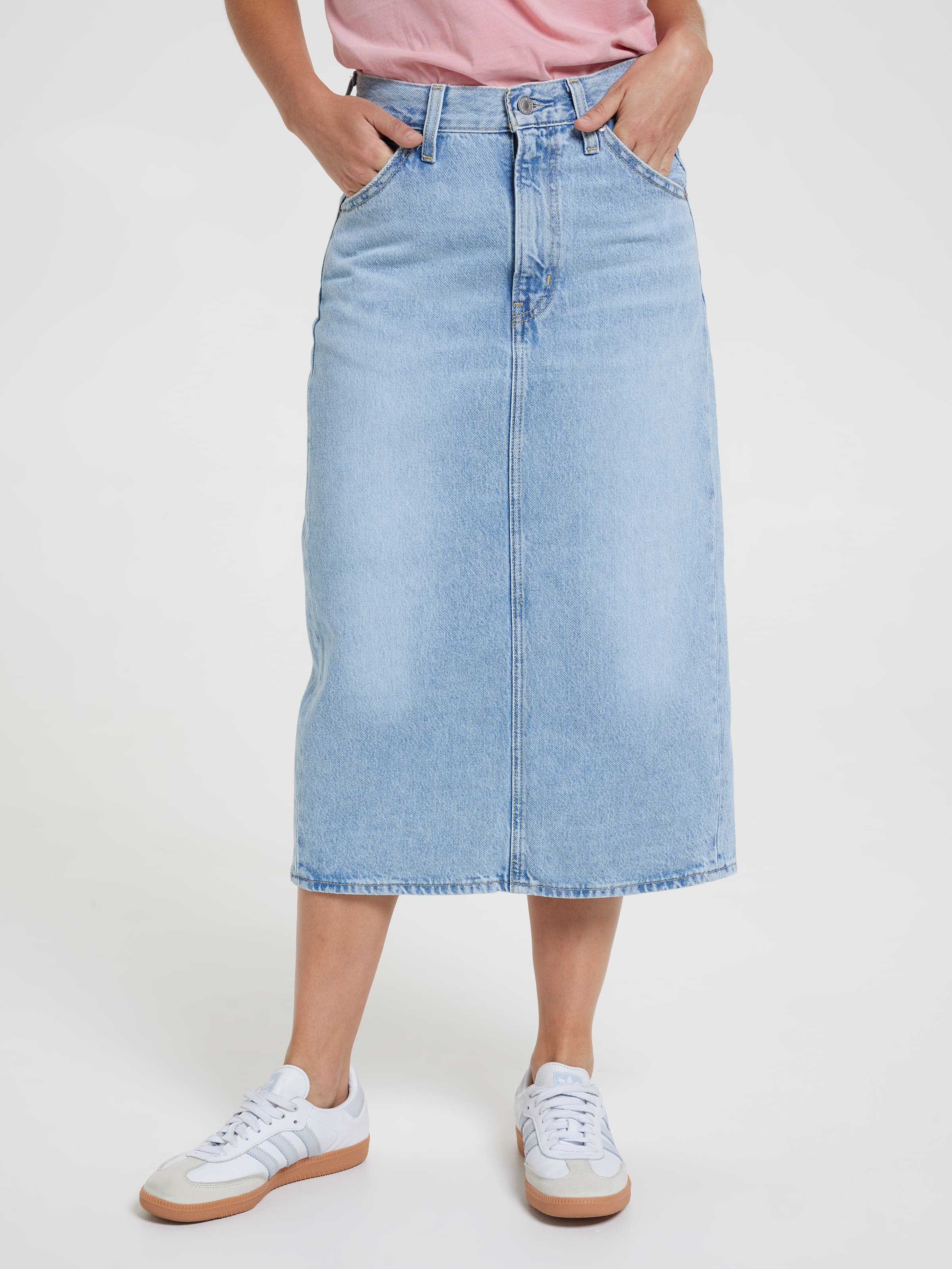 High Rise Back Slit Skirt In Riveting Clean Hem